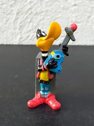 Figura Looney Tunes Pato Lucas Rockstar Pvc 1995 Pluma — Coleccionables vintage, años 90s